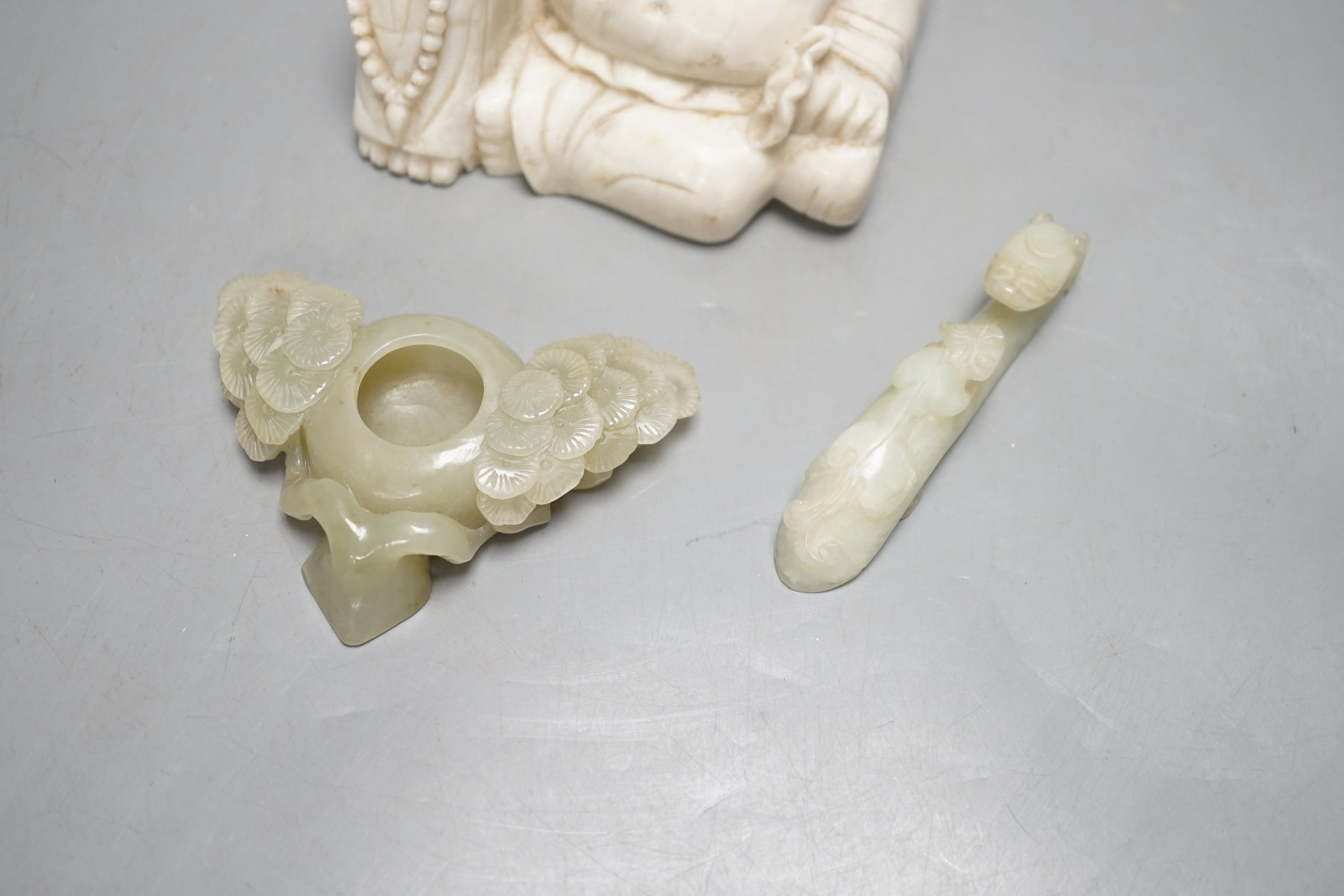 A Chinese celadon jade brushwasher, a bowenite jade belt hook and a soapstone figure of Budai, buddha 7.5 cms high.